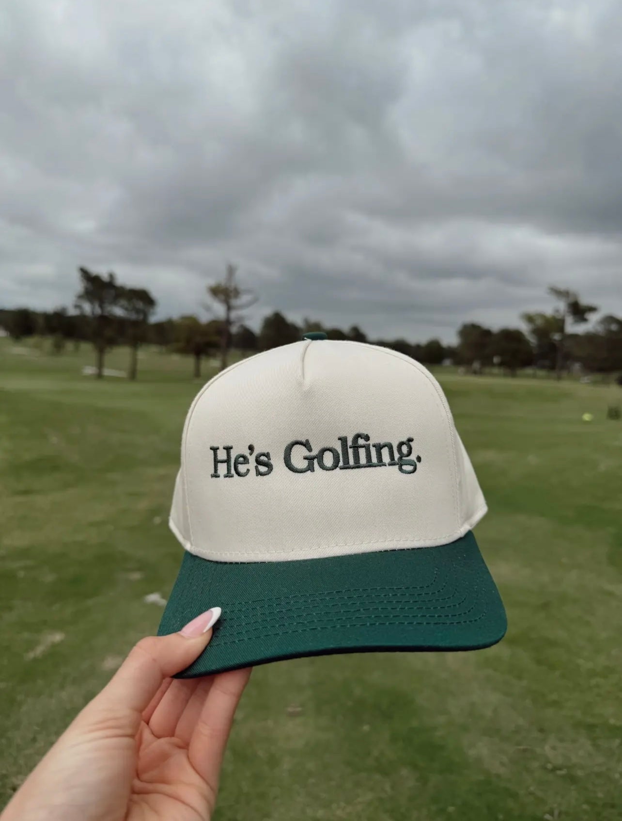 He's Golfing Embroidered Trucker